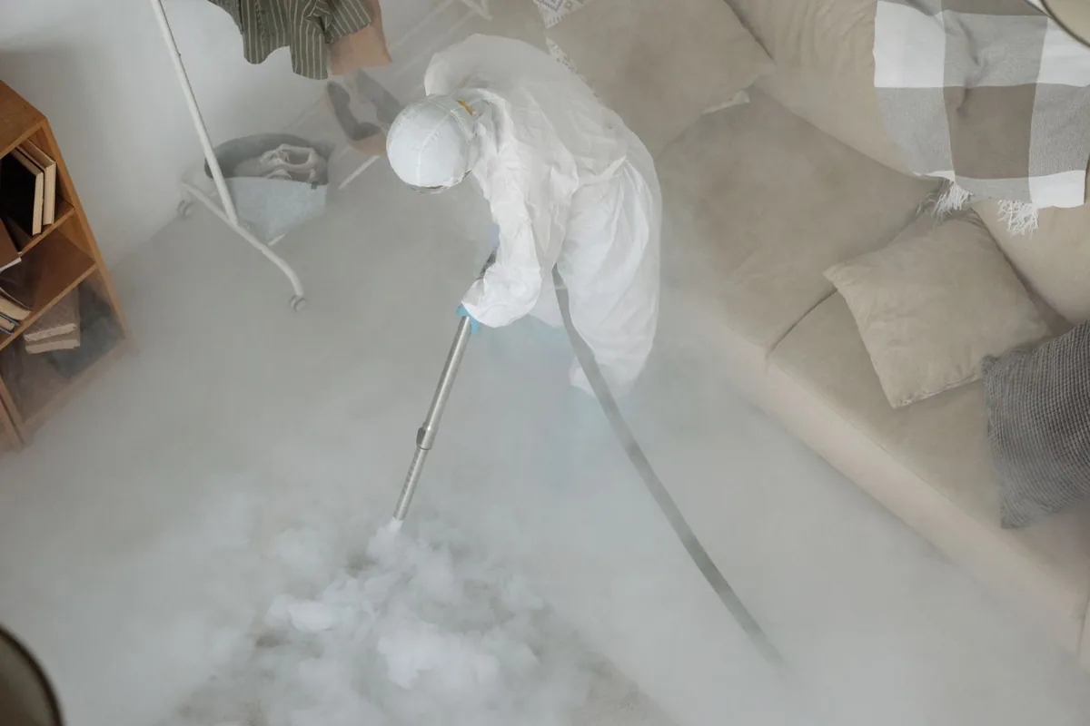 Biohazard cleanup technician in protective equipment, Wyncote, PA